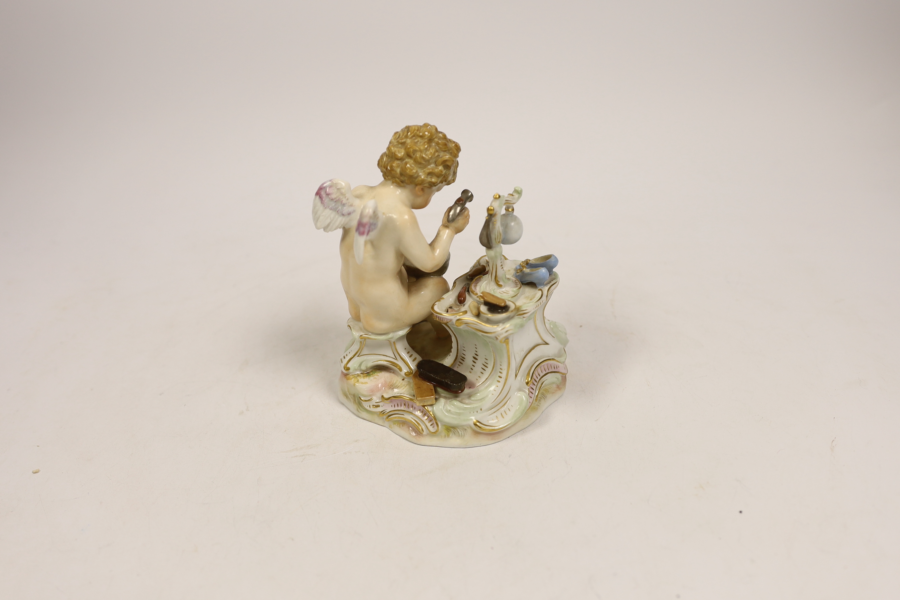 A Meissen figure of Cupid in disguise as a cobbler, 19th century, 12cm